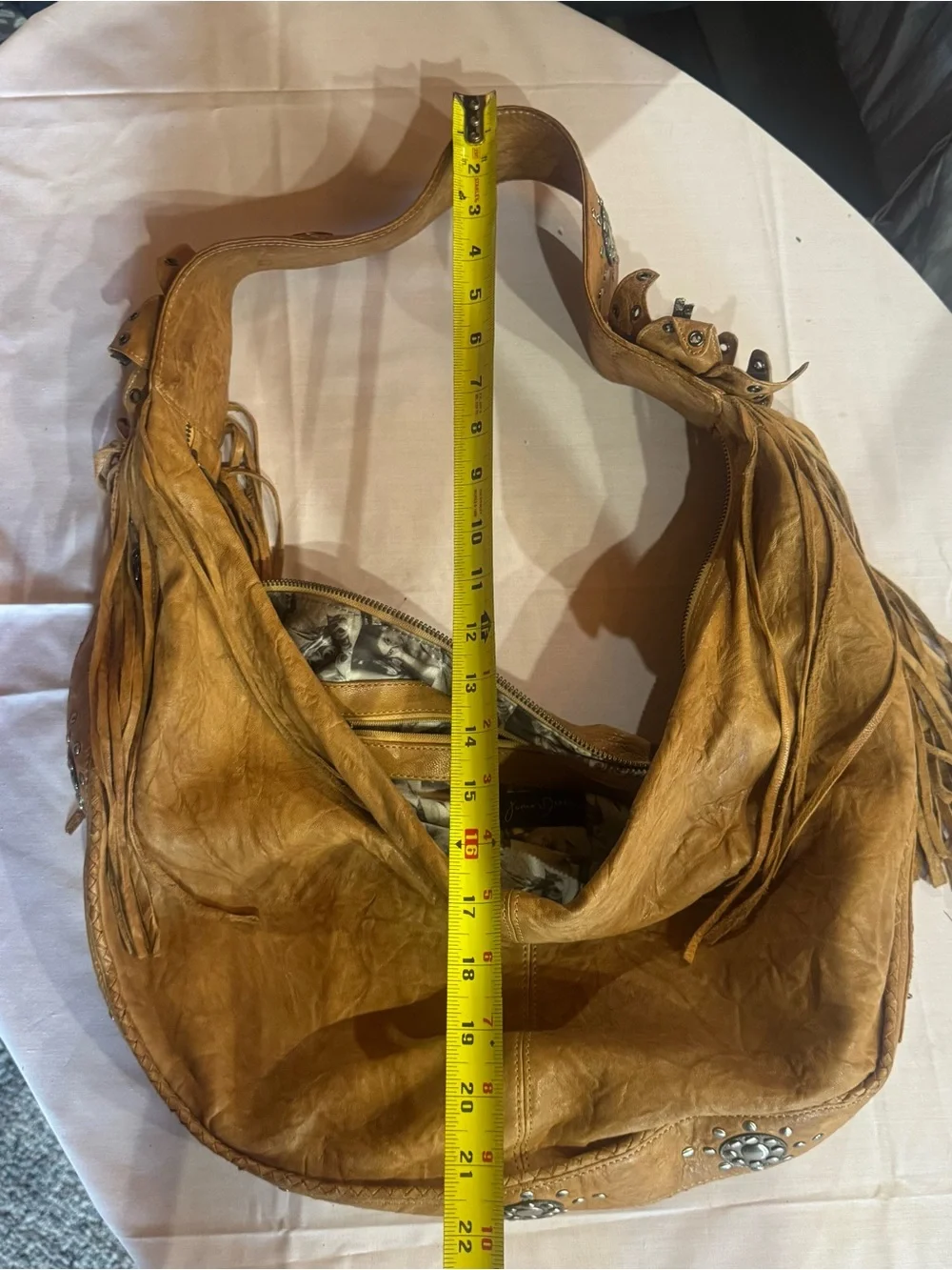Junior Drake  studded and Fringed Leather Hobo Bag in light brown.  Western edge